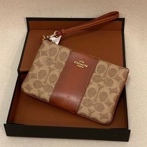 Brown wristlet in colorblock signature canvas